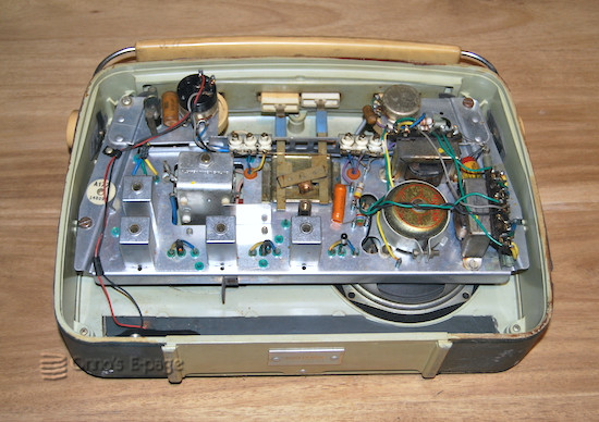 
    A view from the back at the chassis, revealing glass-encased germanium transistors.
    